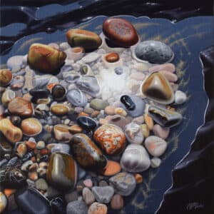 Tableau hyperréaliste « Clair-obscur » de Nicole Madec représentant des galets multicolores aux reflets lumineux, entourés de zones sombres.